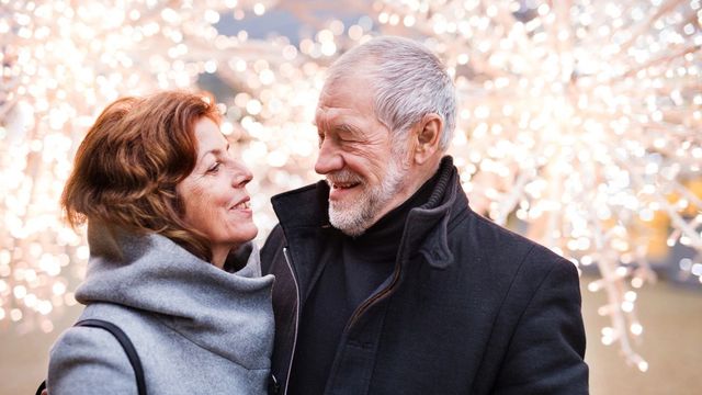 Couple smiling at each other in winter