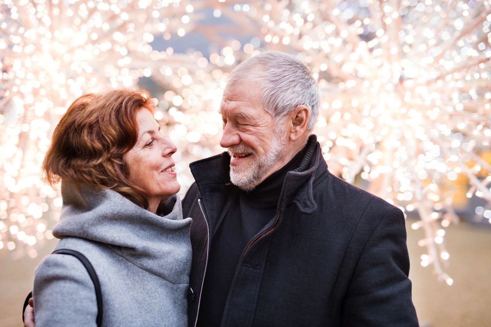 Couple smiling at each other in winter