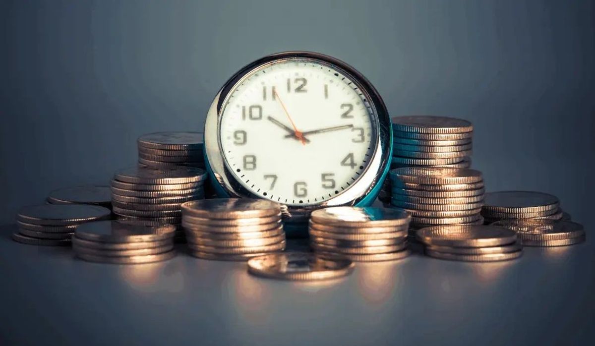 Coins stacked around a watch