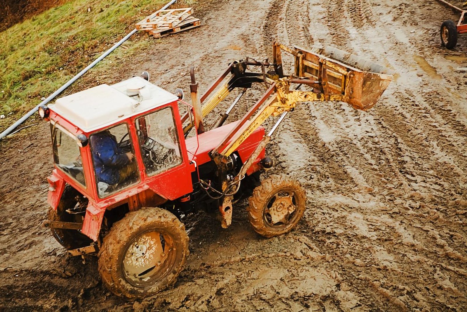 tractor moving mud