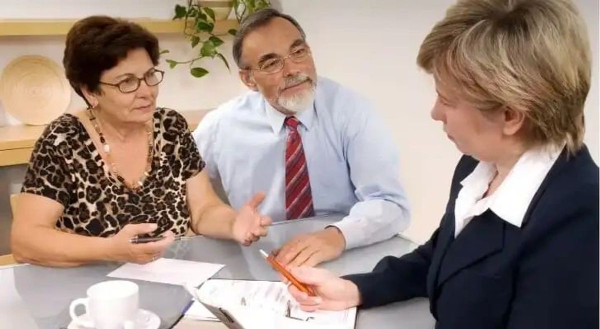 retired couple meeting with attorney