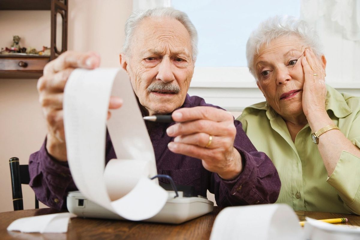 retired couple confused at bills