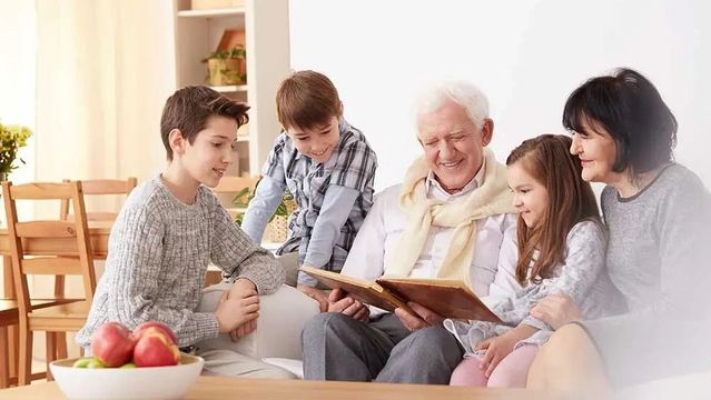 Family reading a book all together