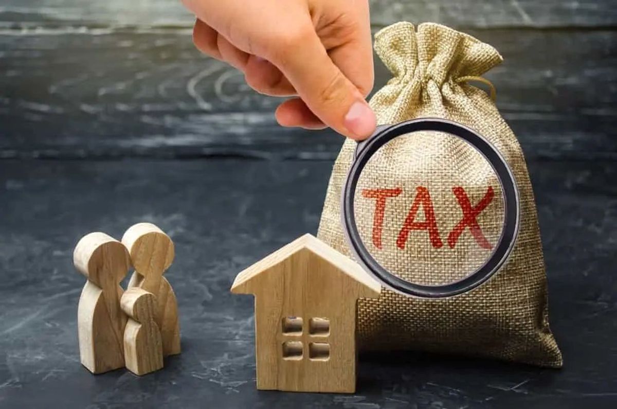 tax graphic with a magnifying glass