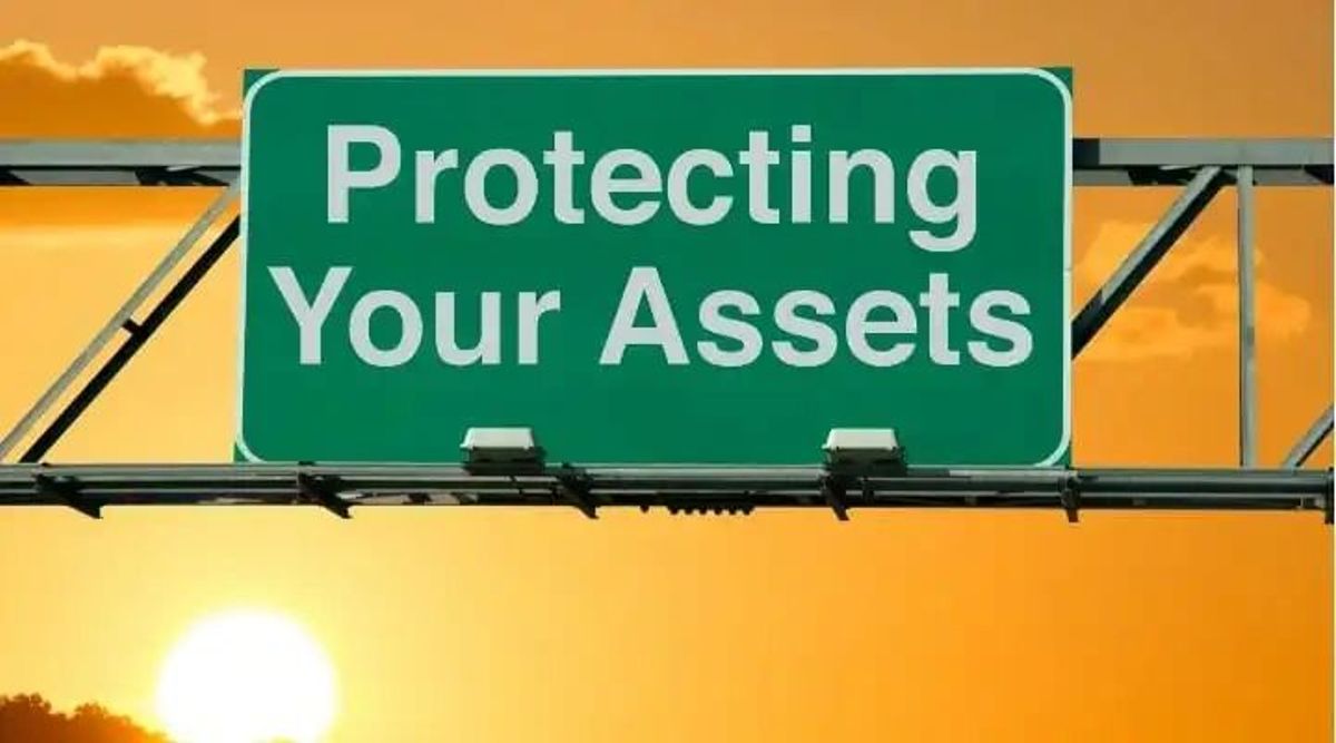 graphic road sign saying protecting your assets