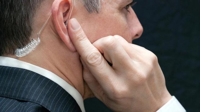 Secret service talking on earpiece