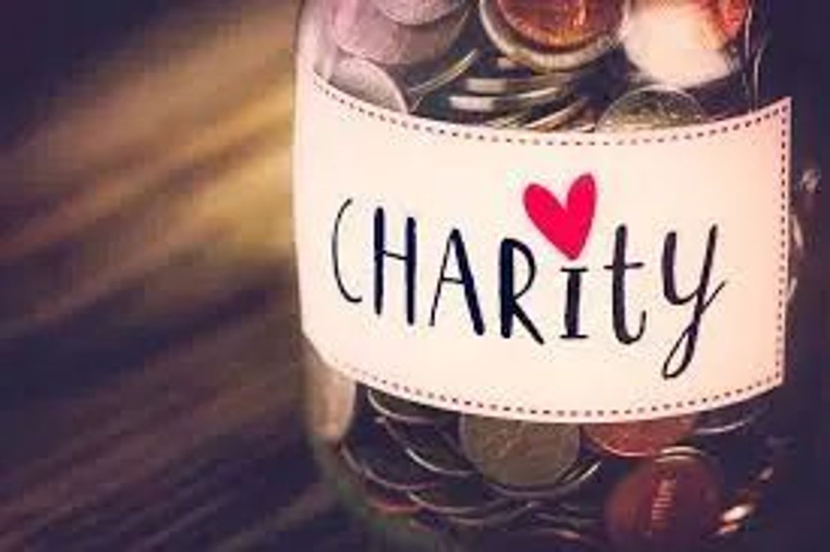 Jar of coins labeled charity