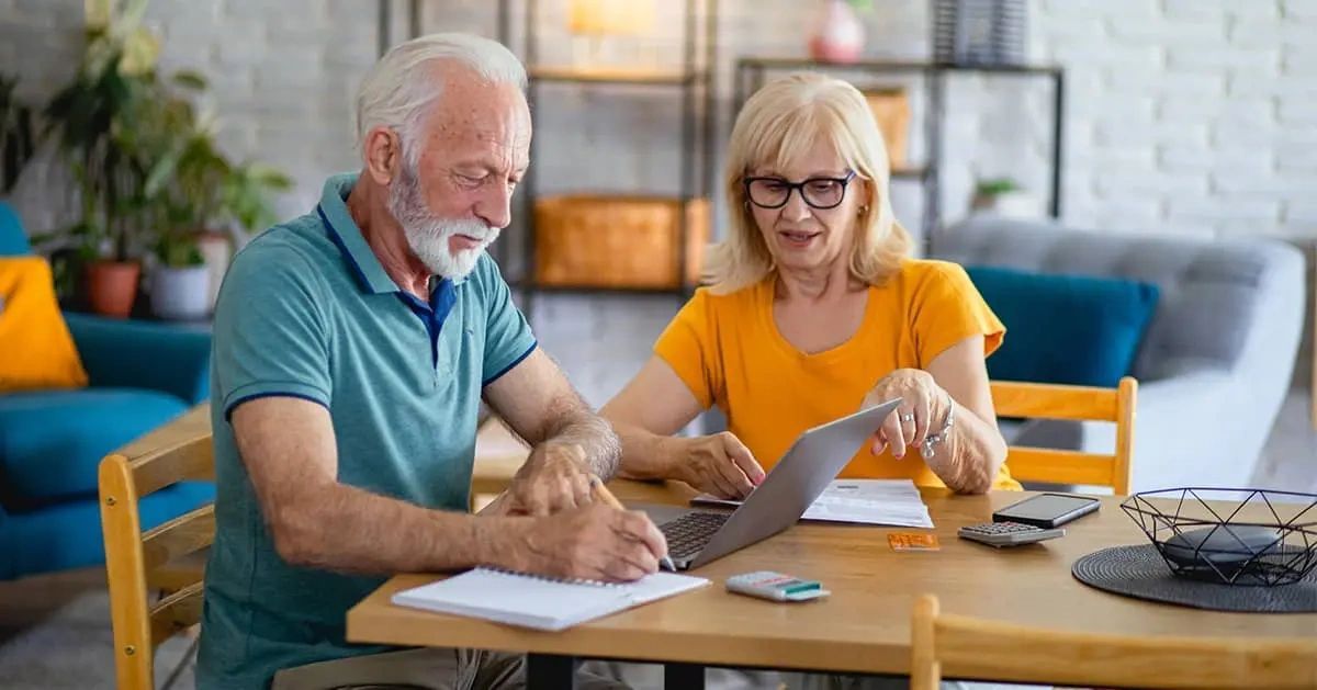 Retirees at dinner table calculating their AGI