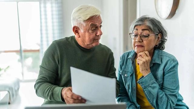 Retired couple looking at a financial plan