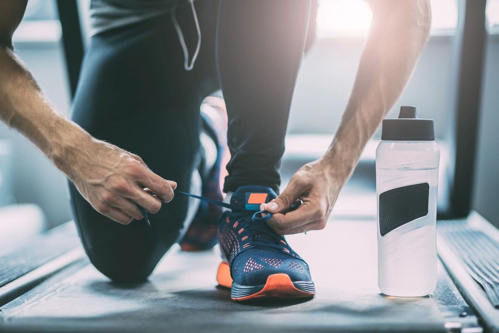 Tying shoe on trendmill