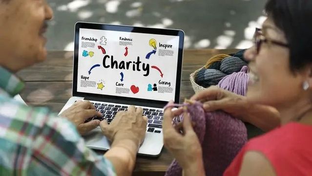 couple talking while looking at reasons to give to charity