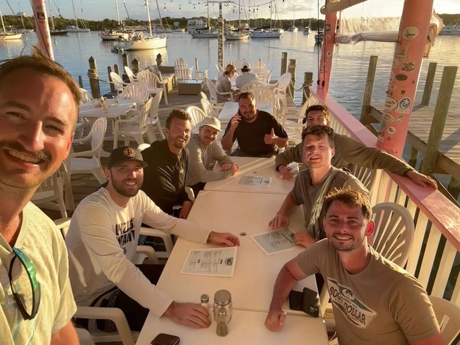 Friends having dinner on a Bahama dock