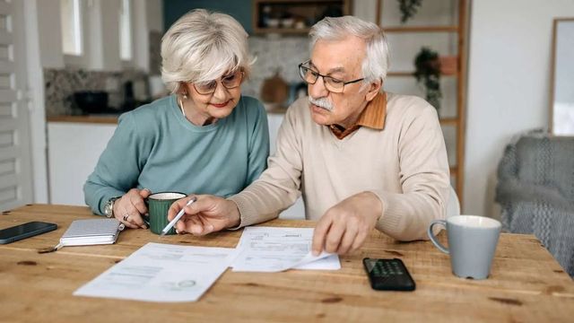 Retired couple reviewing a tax-efficient retirement income plan