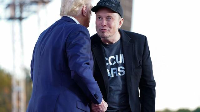 Elon Musk and Donald Trump shaking hands