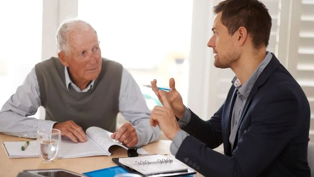 Adult beneficiary reviewing inherited IRA paperwork and financial documents after the SECURE Act