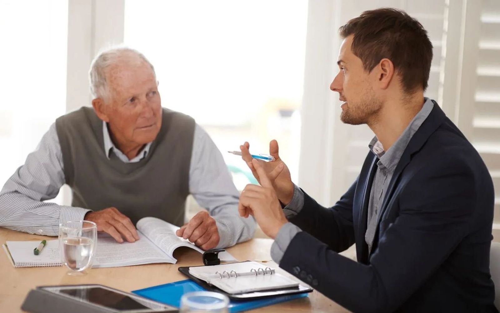 Adult beneficiary reviewing inherited IRA paperwork and financial documents after the SECURE Act