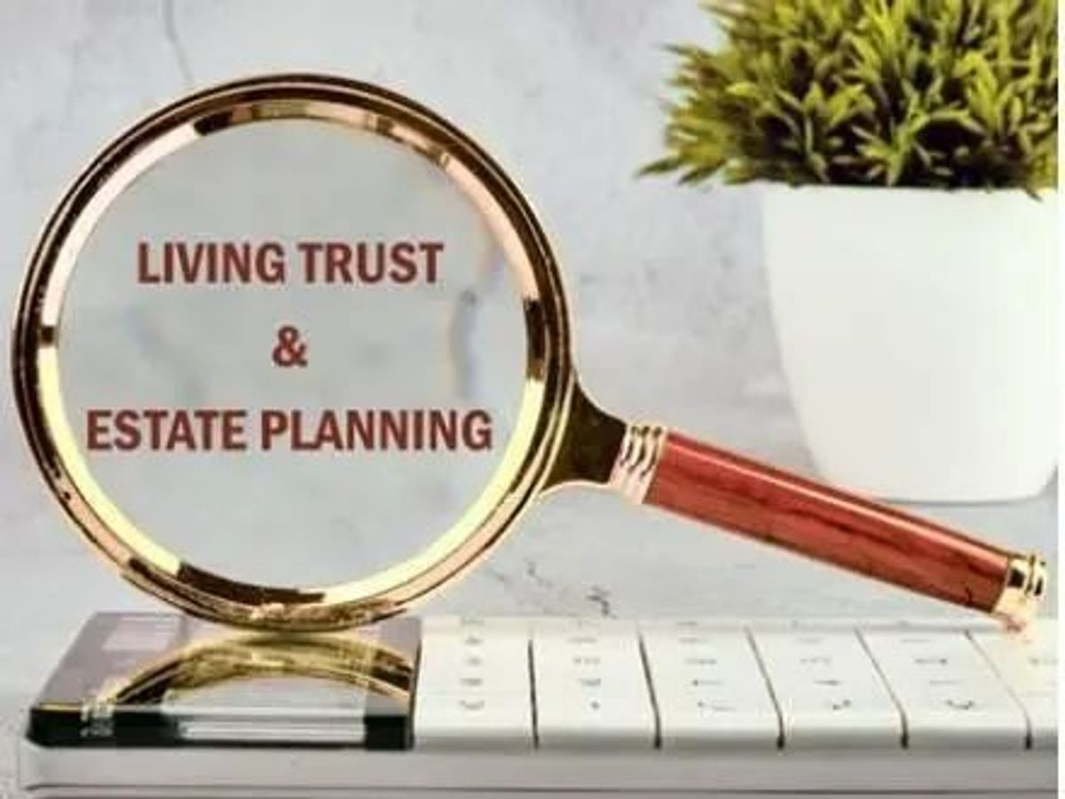 Magnifying glass over living trust and estate planning title