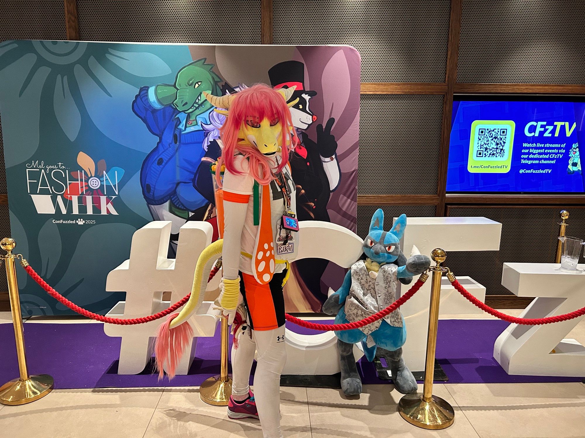 Isabella as an inkling girl, alongside a lifesize plushie Lucario.