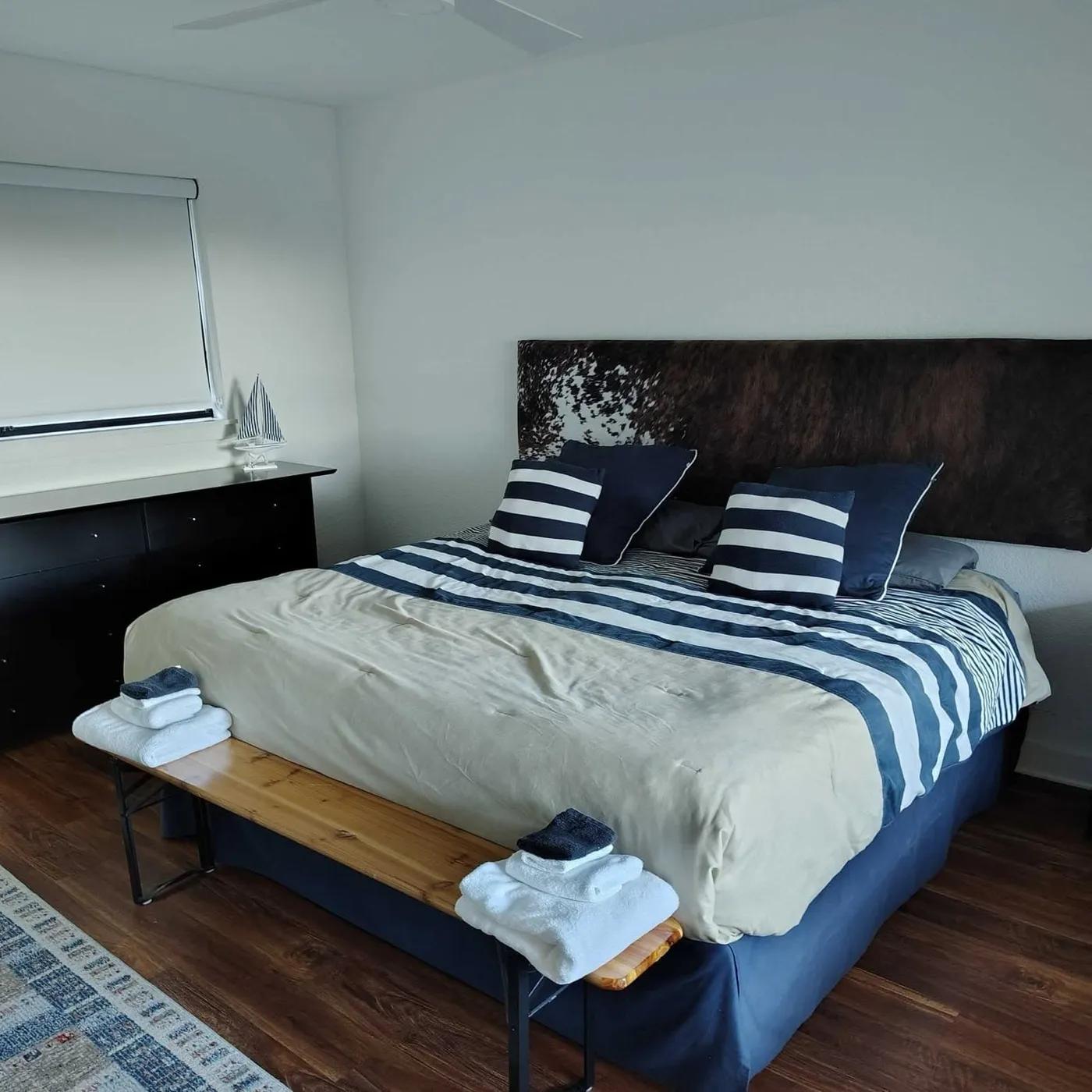 Made bed in a clean bedroom