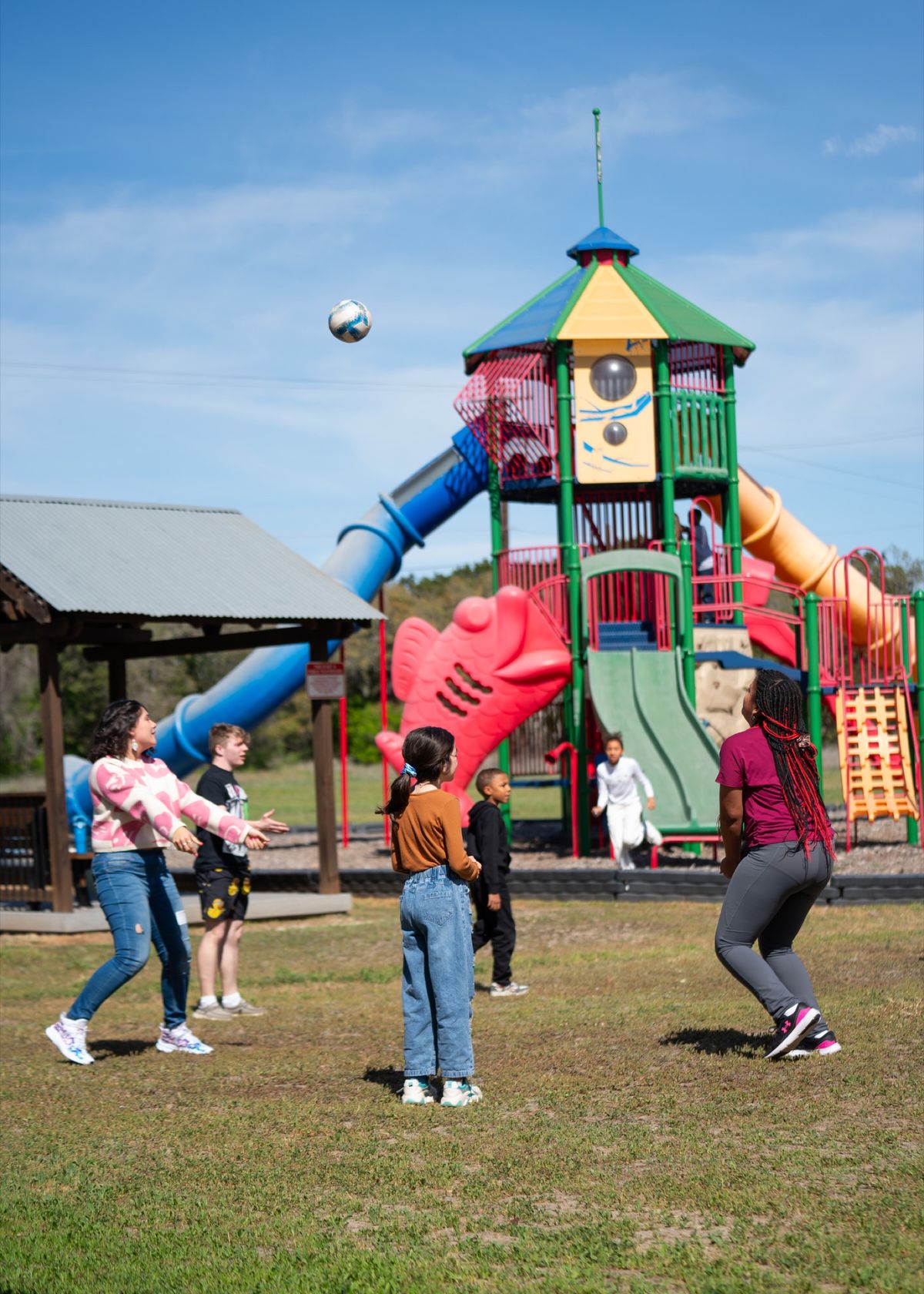 Kids playing outside on the CFC playground