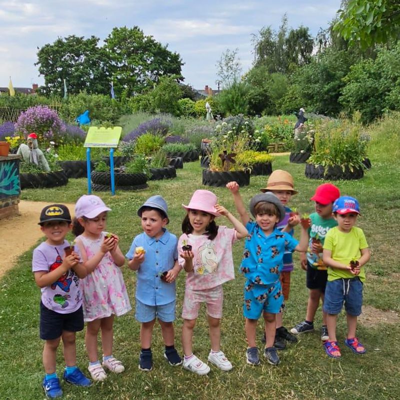 Kids gardening outdoors.