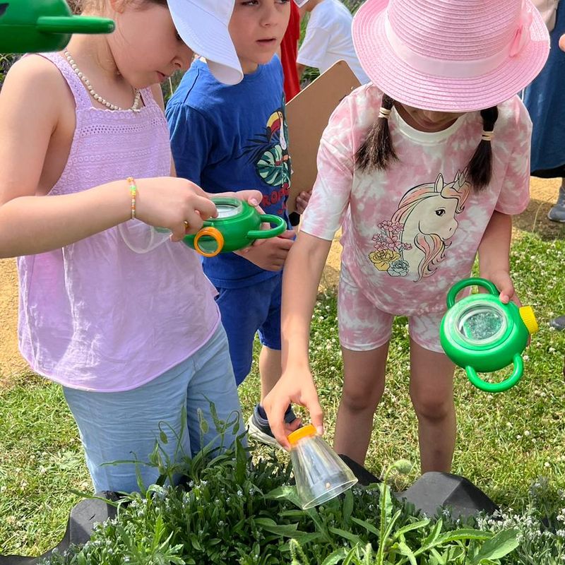 Kids gardening outdoors.