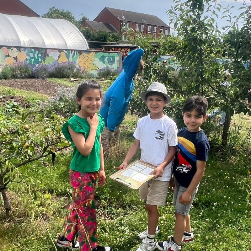 Kids gardening outdoors.