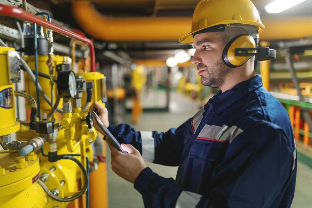 Industrial hygienist measuring sound exposure on the production floor
