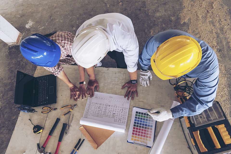 Safety team reviewing hazard control procedures at worksite