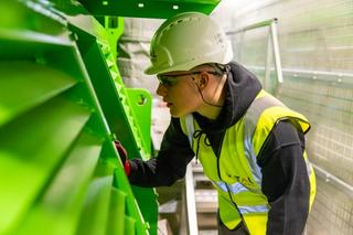 Warehouse worker undergoing retraining after forklift safety incident.