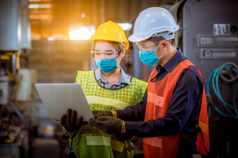 EHS consultants performing workplace safety audit.