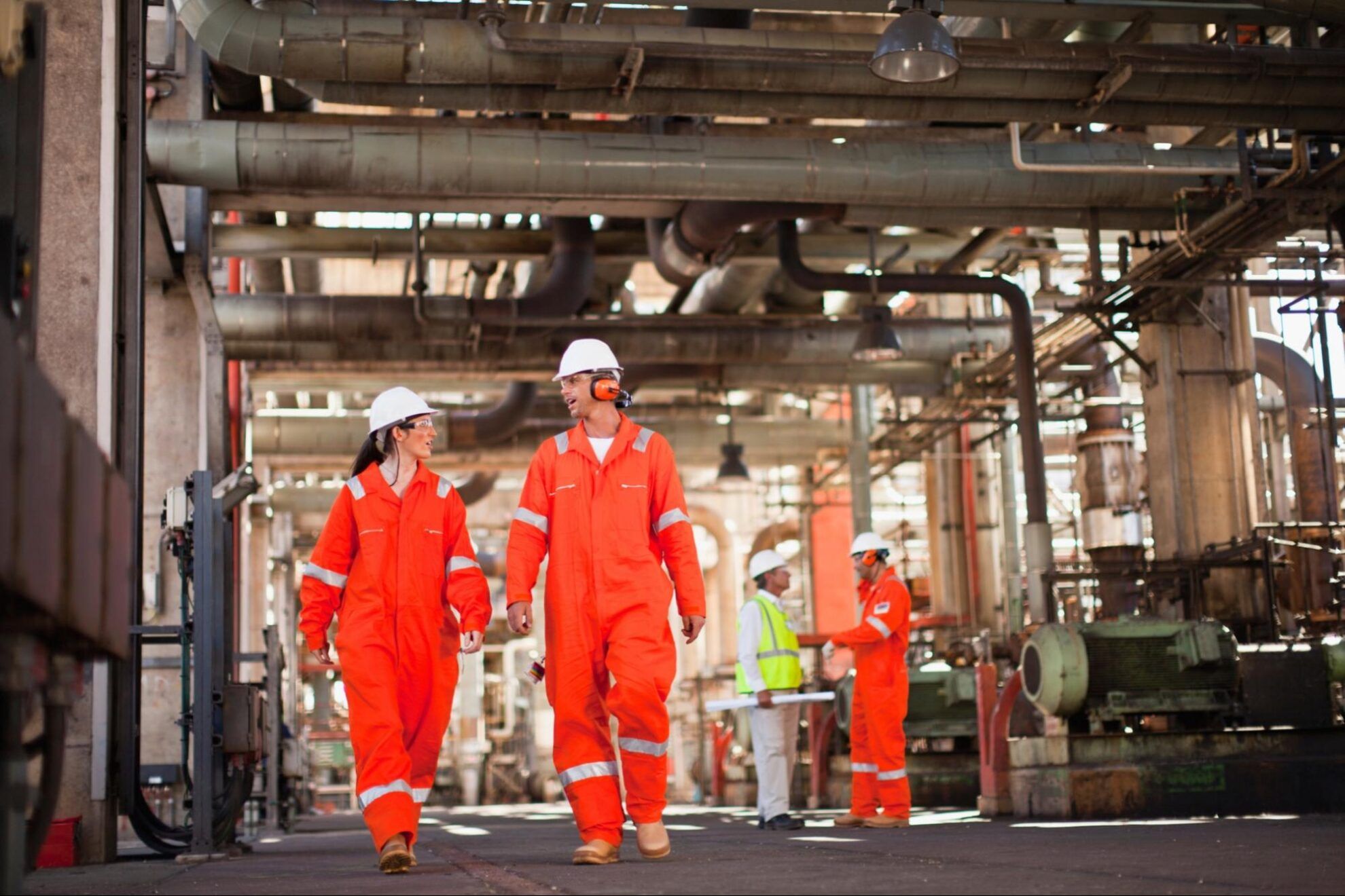 EHS team conducting safety inspection at an oil and gas site.