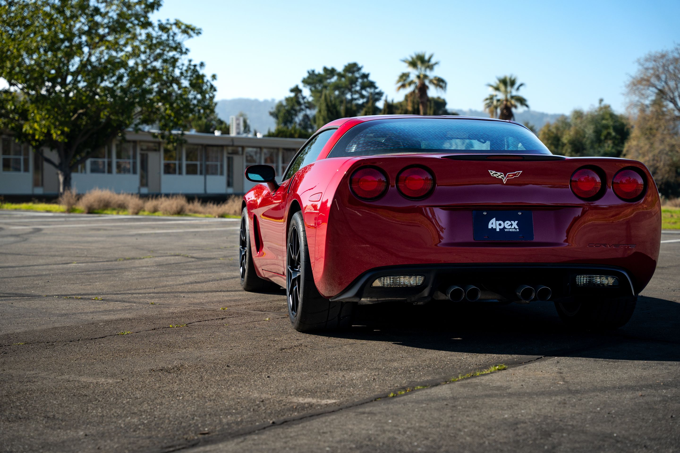 Red Chevrolet C6 Corvette Base/Z51 with 18" VS-5 Apex wheels in Satin Black