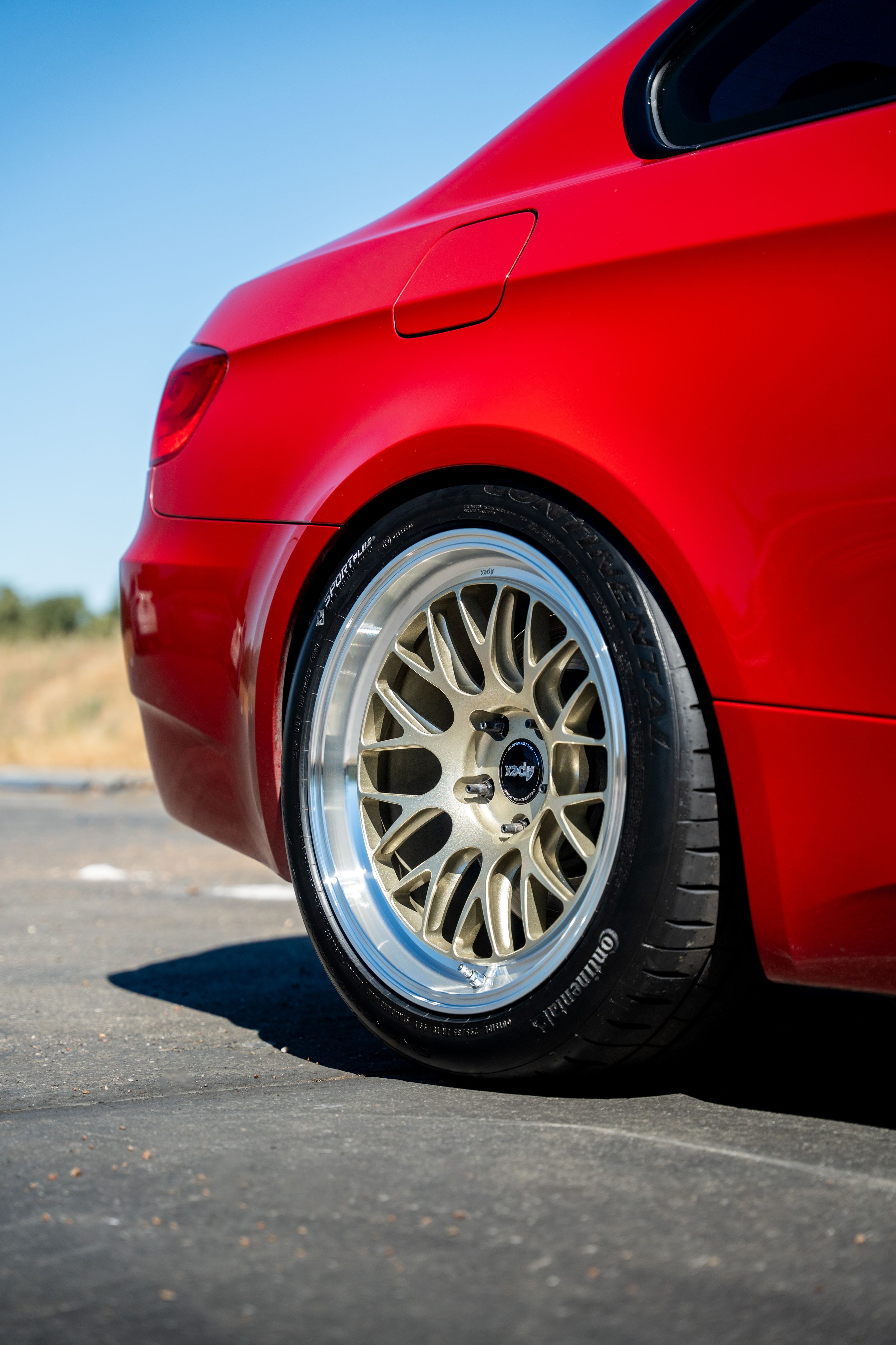Red BMW E92 Coupe M3 with 18" ML-10RT Apex wheels in Machined Lip Gloss Motorsport Gold