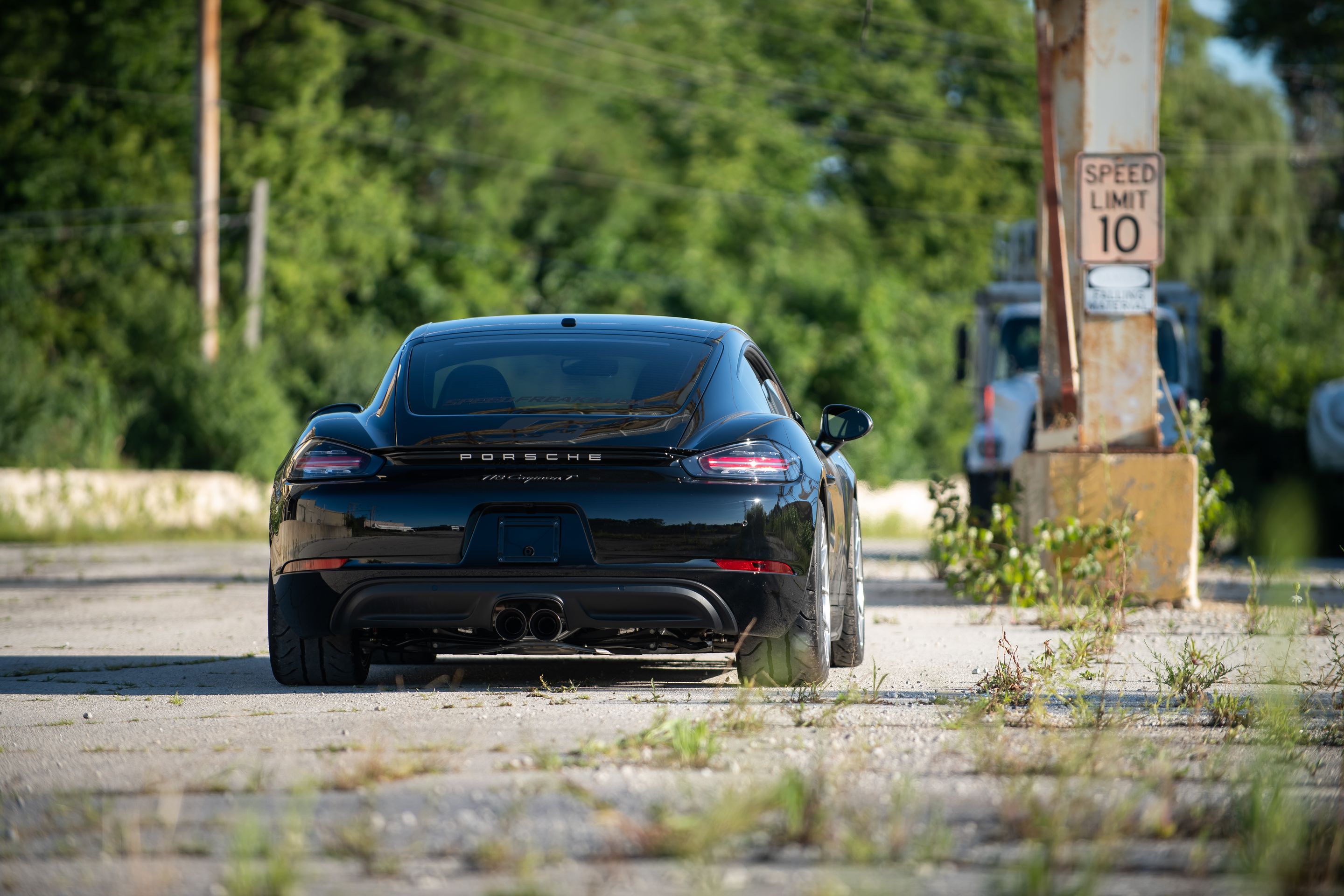 Black Porsche 718 Cayman T with 18" VS-5RS Apex wheels in Brushed Clear