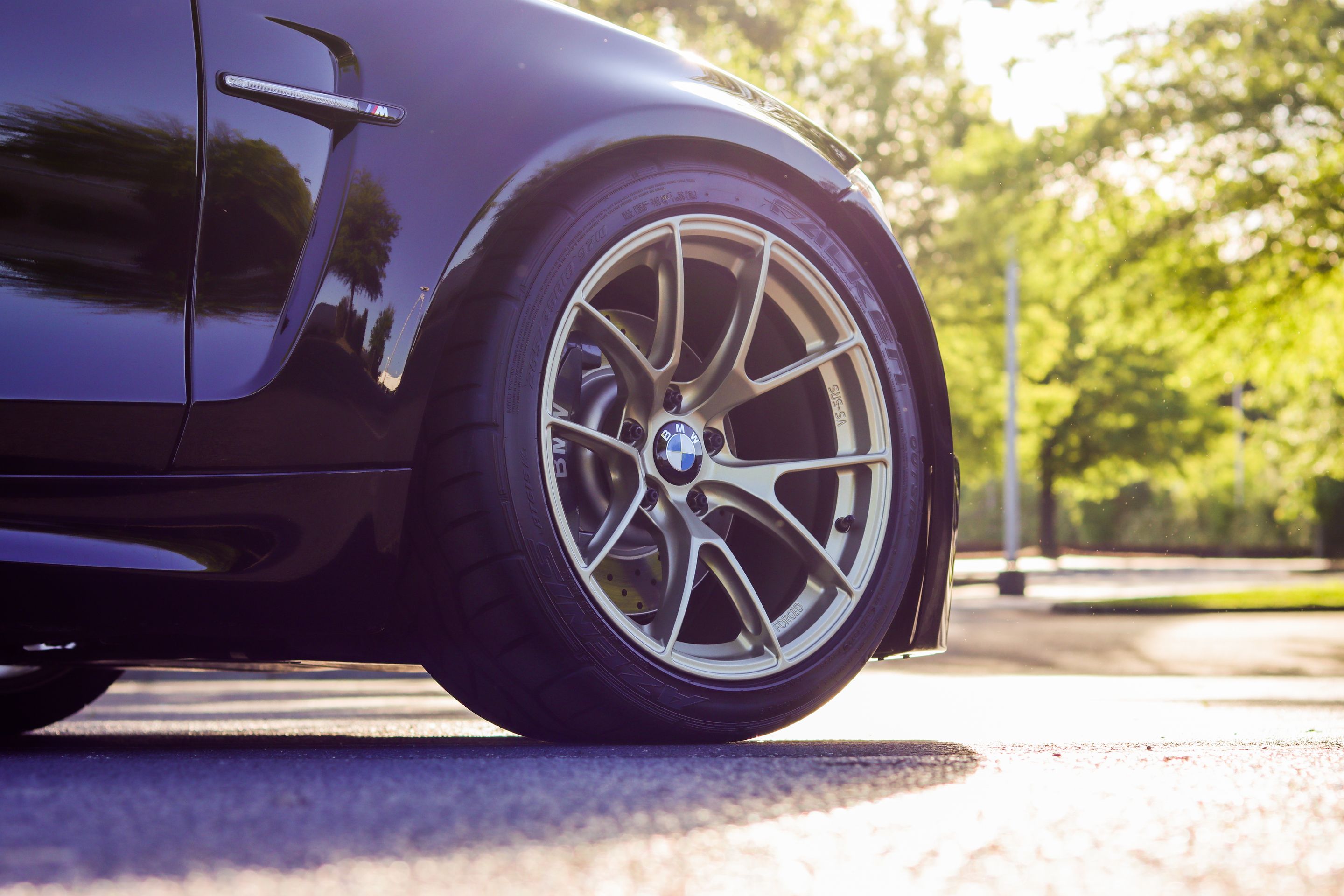 Black BMW E82 Coupe 1 Series with 18" VS-5RS Apex wheels in Motorsport Gold