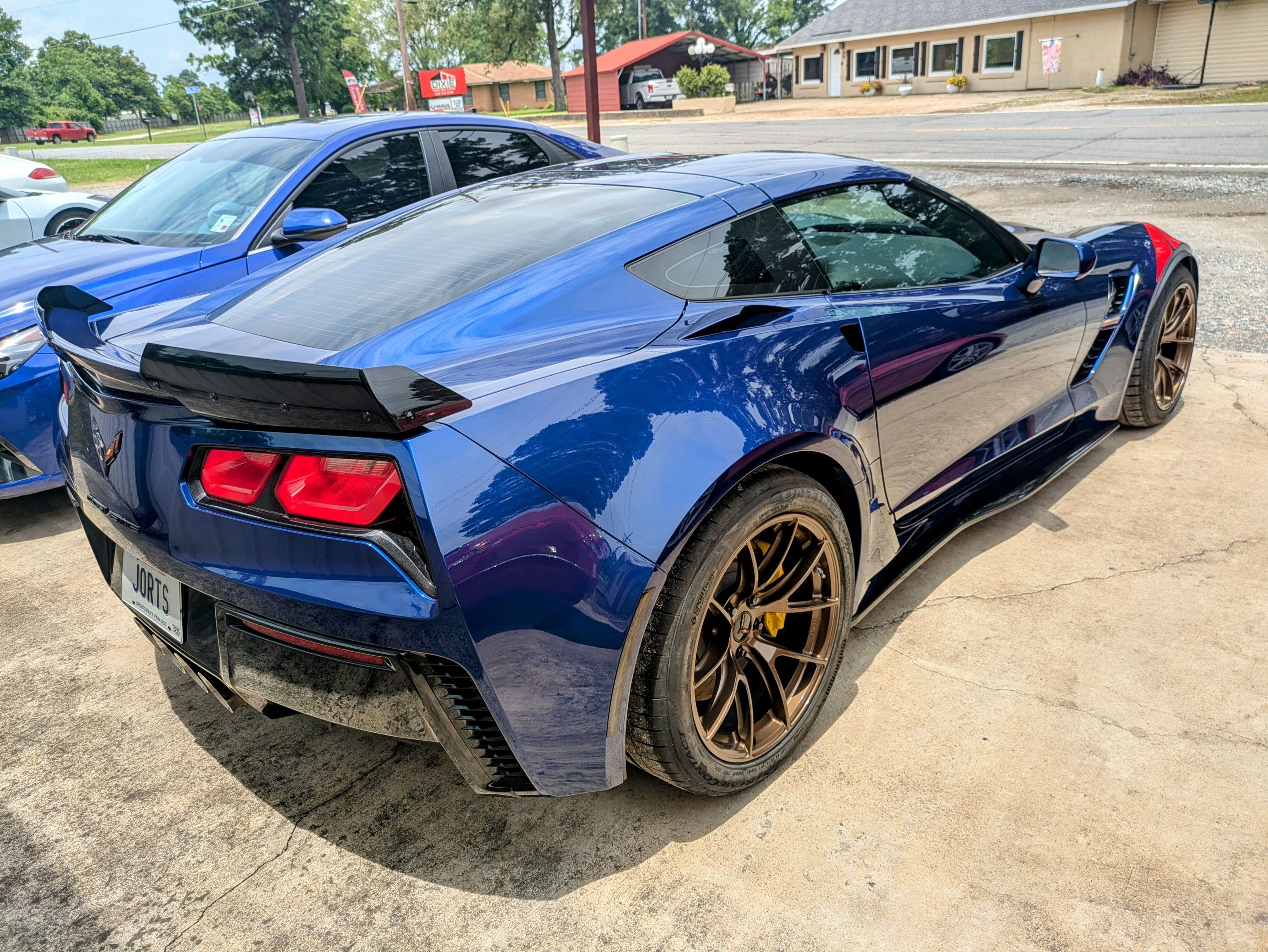 Blue Chevrolet C7 Corvette Grand Sport with 18"/19" VS-5RS Apex wheels in Satin Bronze