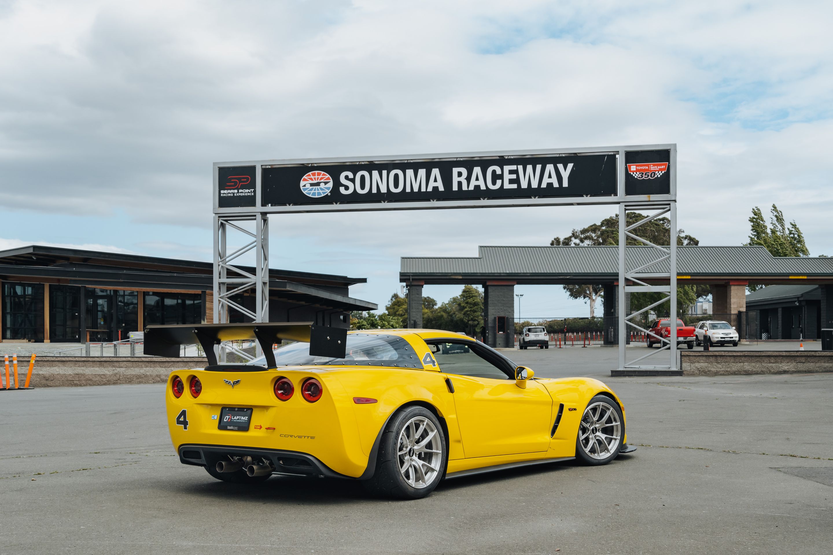 Yellow Chevrolet C6 Corvette Z06 with 18" VS-5RS Apex wheels in Brushed Clear