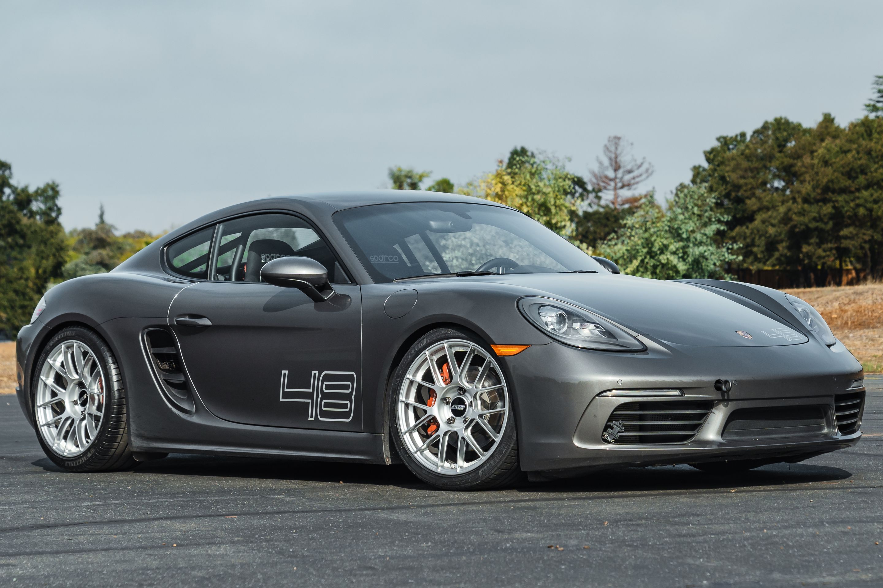 Grey Porsche 718 Cayman S with 19" EC-7RS Apex wheels in Race Silver