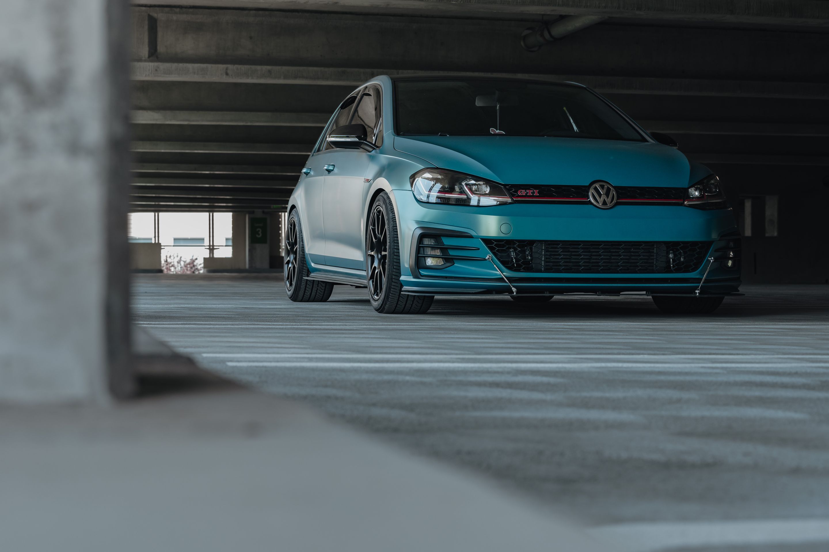 Green VW MK7 GTI with 17" SM-10 Apex wheels in Satin Black
