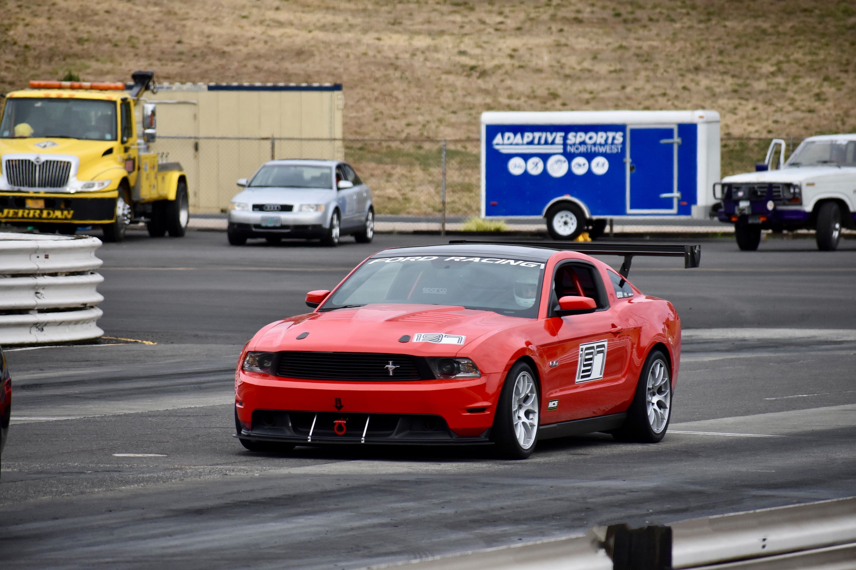 Red Ford S197 Mustang GT with 18" EC-7 Apex wheels in Race Silver