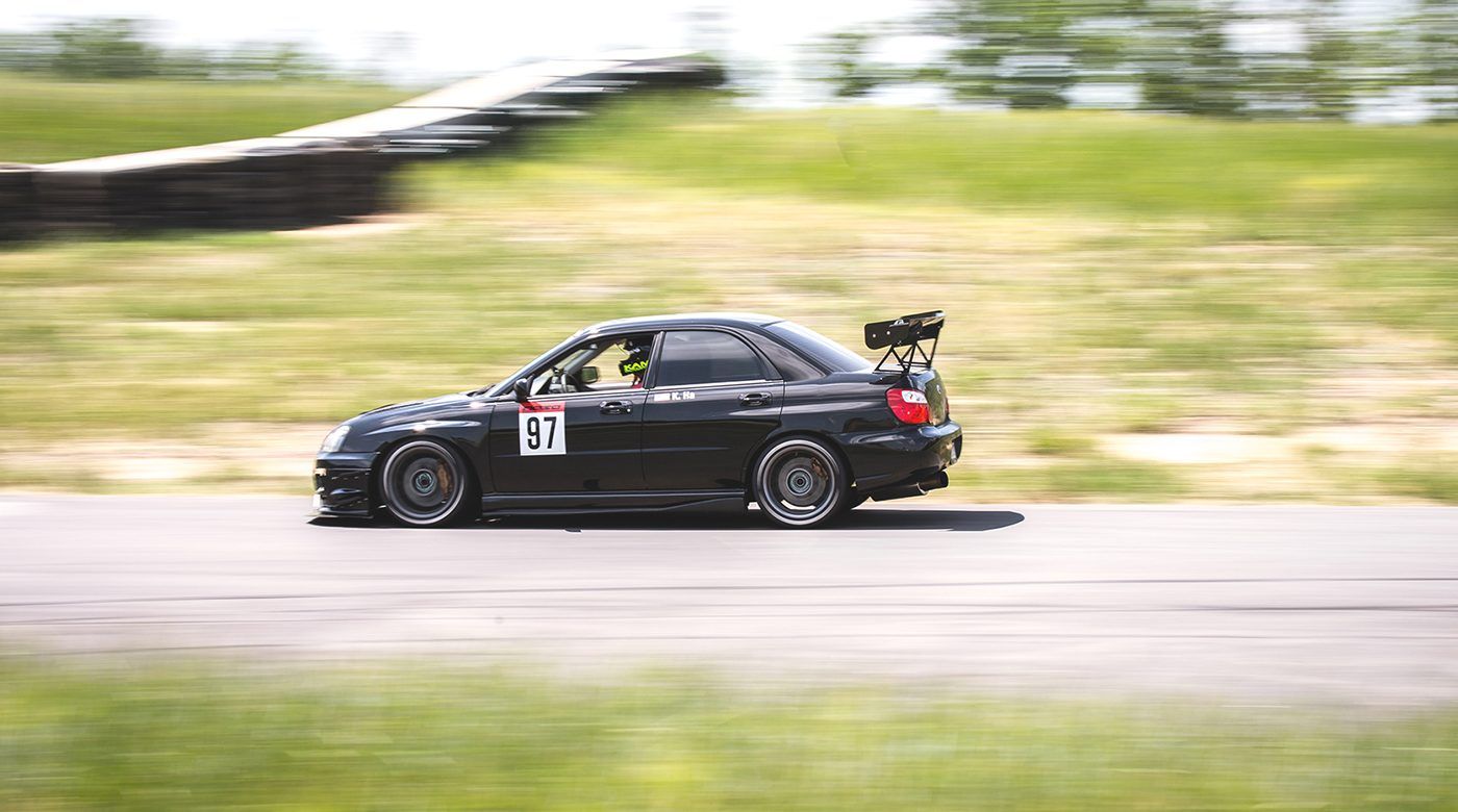 Black Subaru GD WRX Sedan with 17" ARC-8 Apex wheels in Anthracite