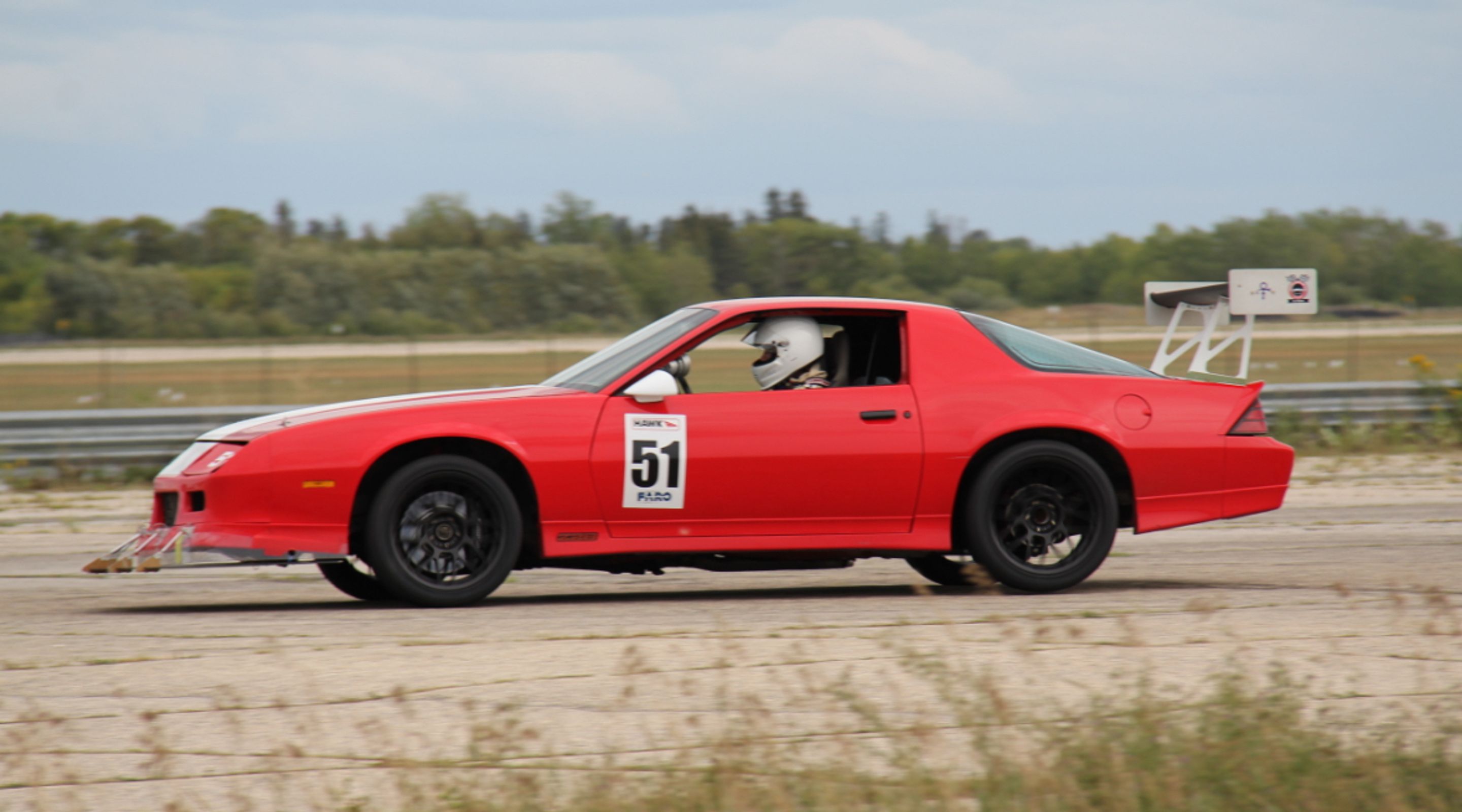 Red Chevrolet 5th Gen Camaro SS with 18" ARC-8 Apex wheels in Satin Black
