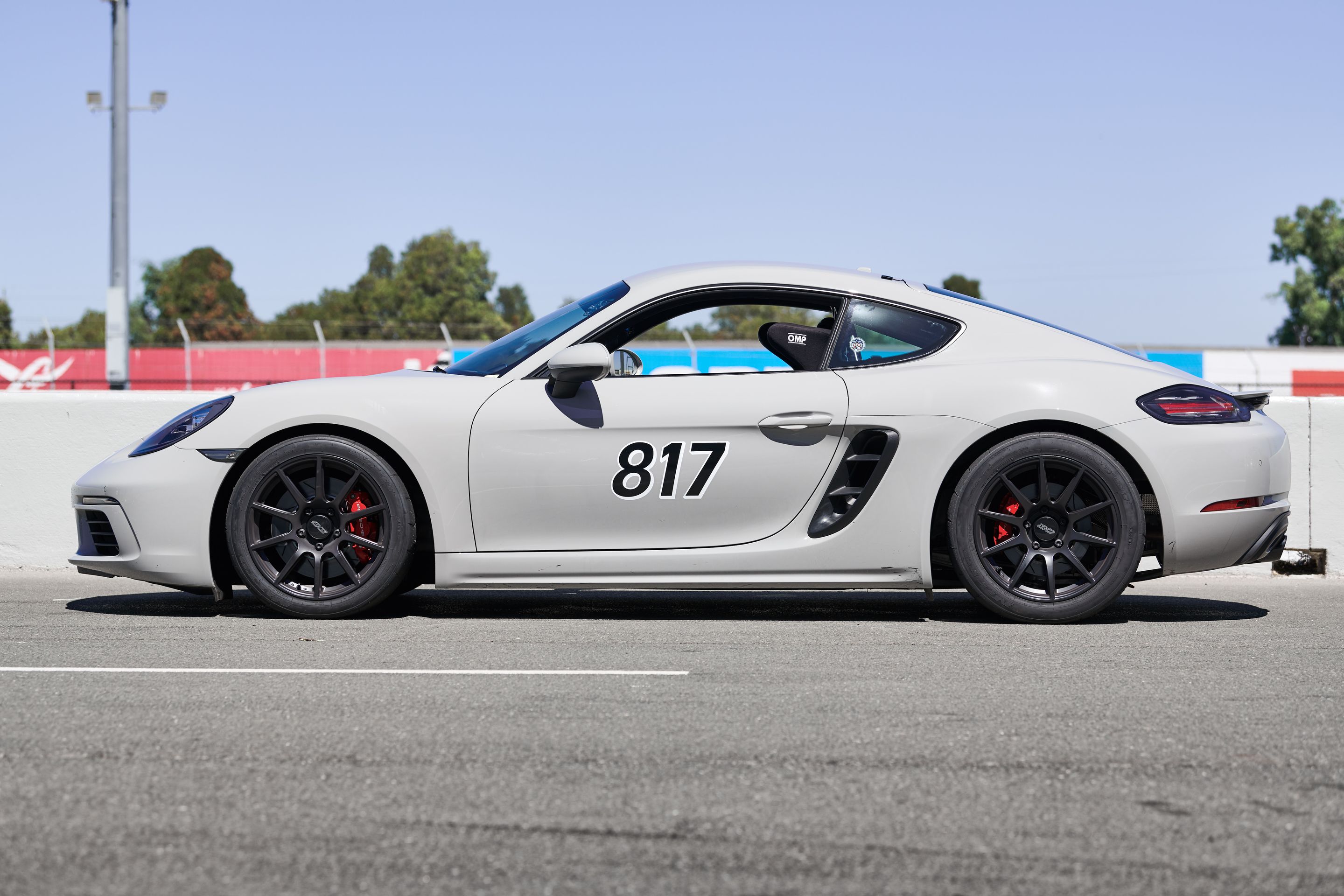 White Porsche 718 Cayman S with 18" SM-10 Apex wheels in Satin Black
