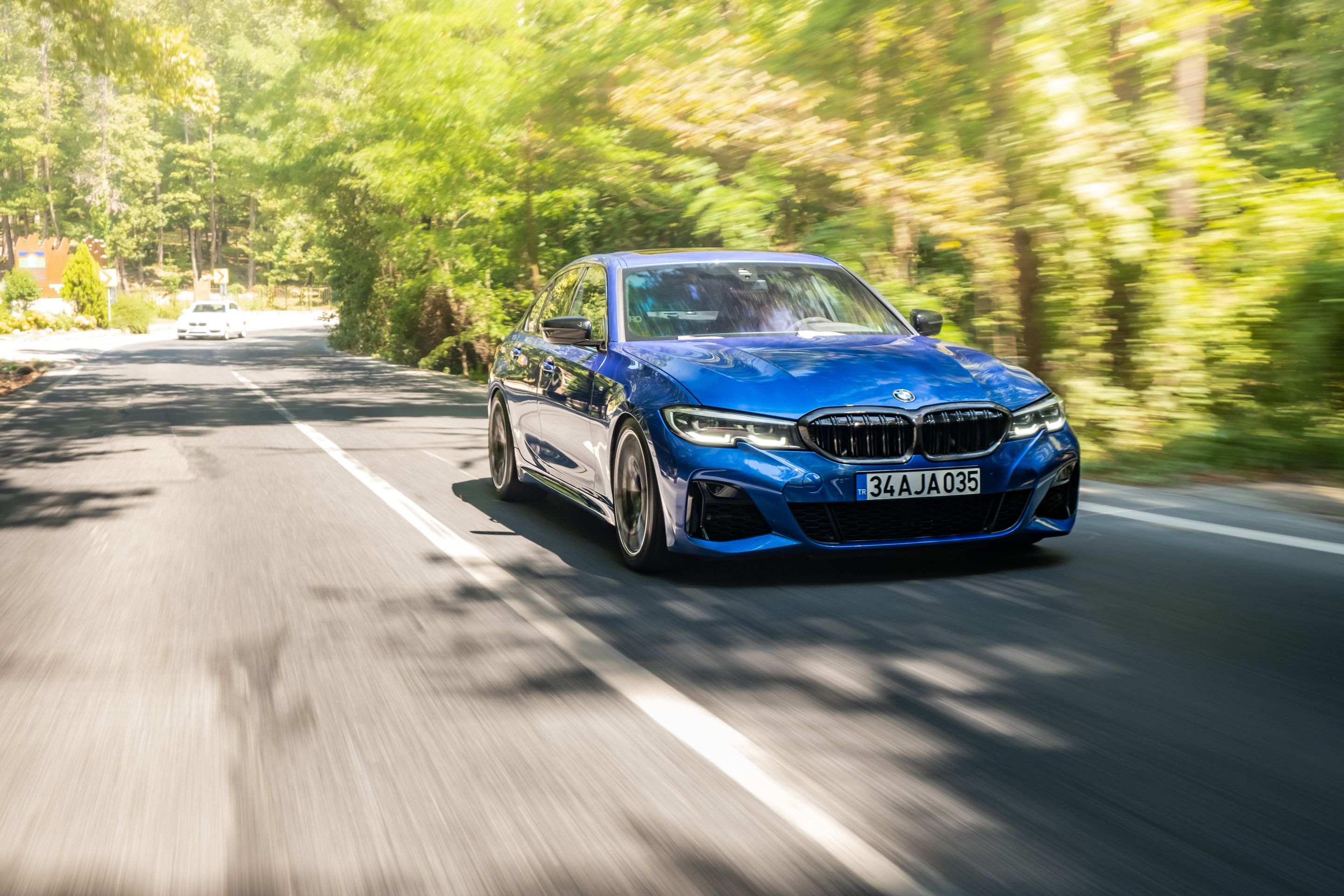 Blue BMW G20 Sedan 3 Series with 19" SM-10 Apex wheels in Anthracite