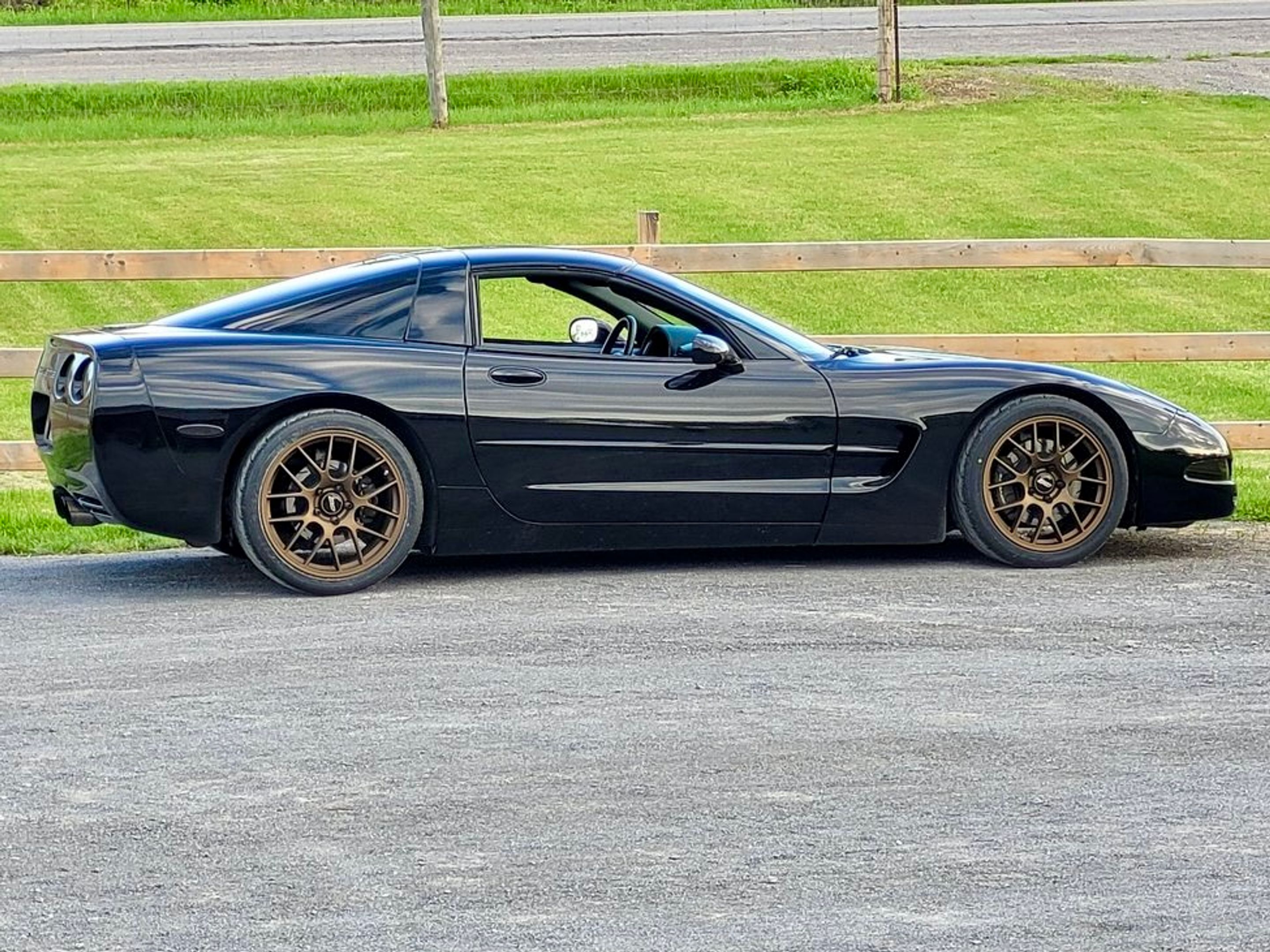 Black Chevrolet C5 Corvette Base/Z51 with 18"/19" EC-7 Apex wheels in Satin Bronze