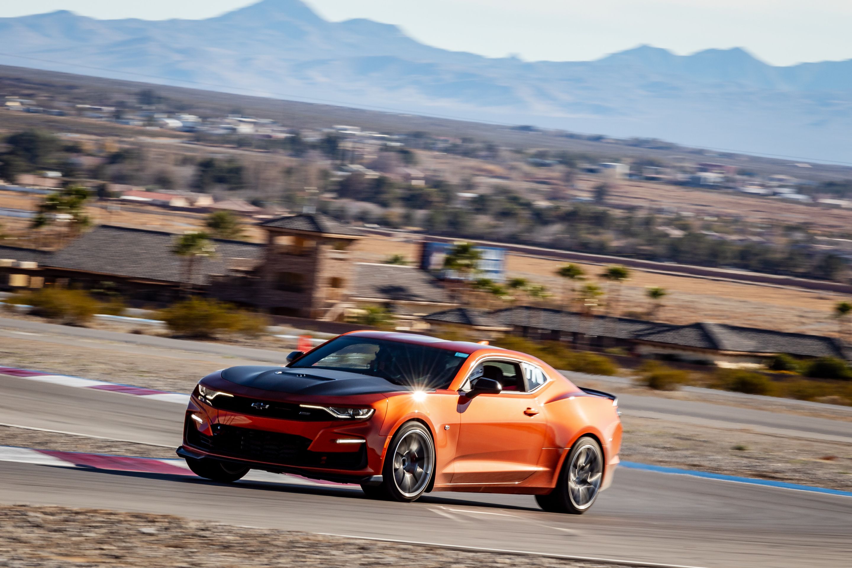 Orange Chevrolet 6th Gen Camaro SS 1LE with 19" VS-5RS Apex wheels in Brushed Clear