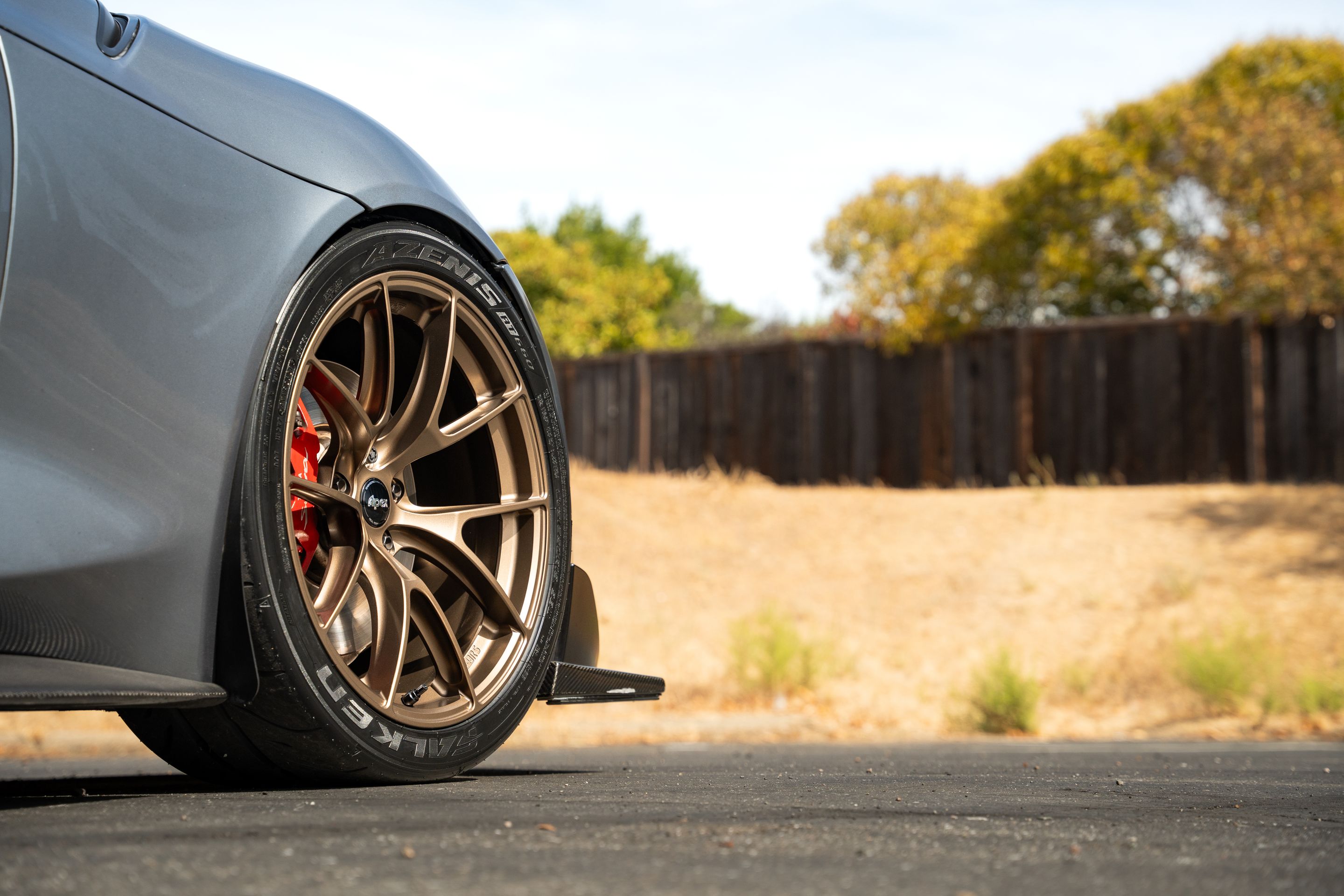 Grey Toyota GR Supra with 19" VS-5RS Apex wheels in Satin Bronze