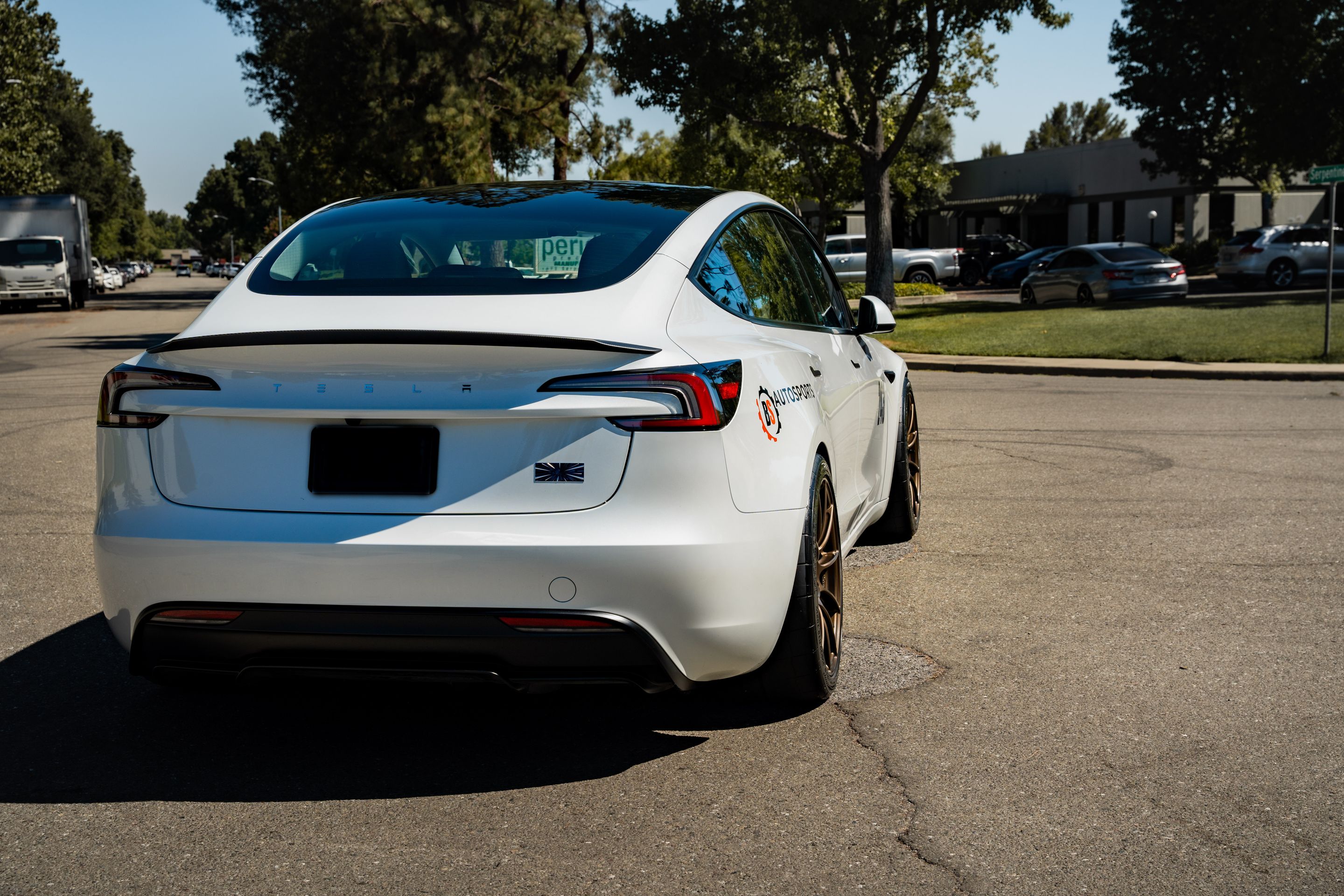 White Tesla Model 3 with 19" SM-10RS Apex wheels in Satin Bronze