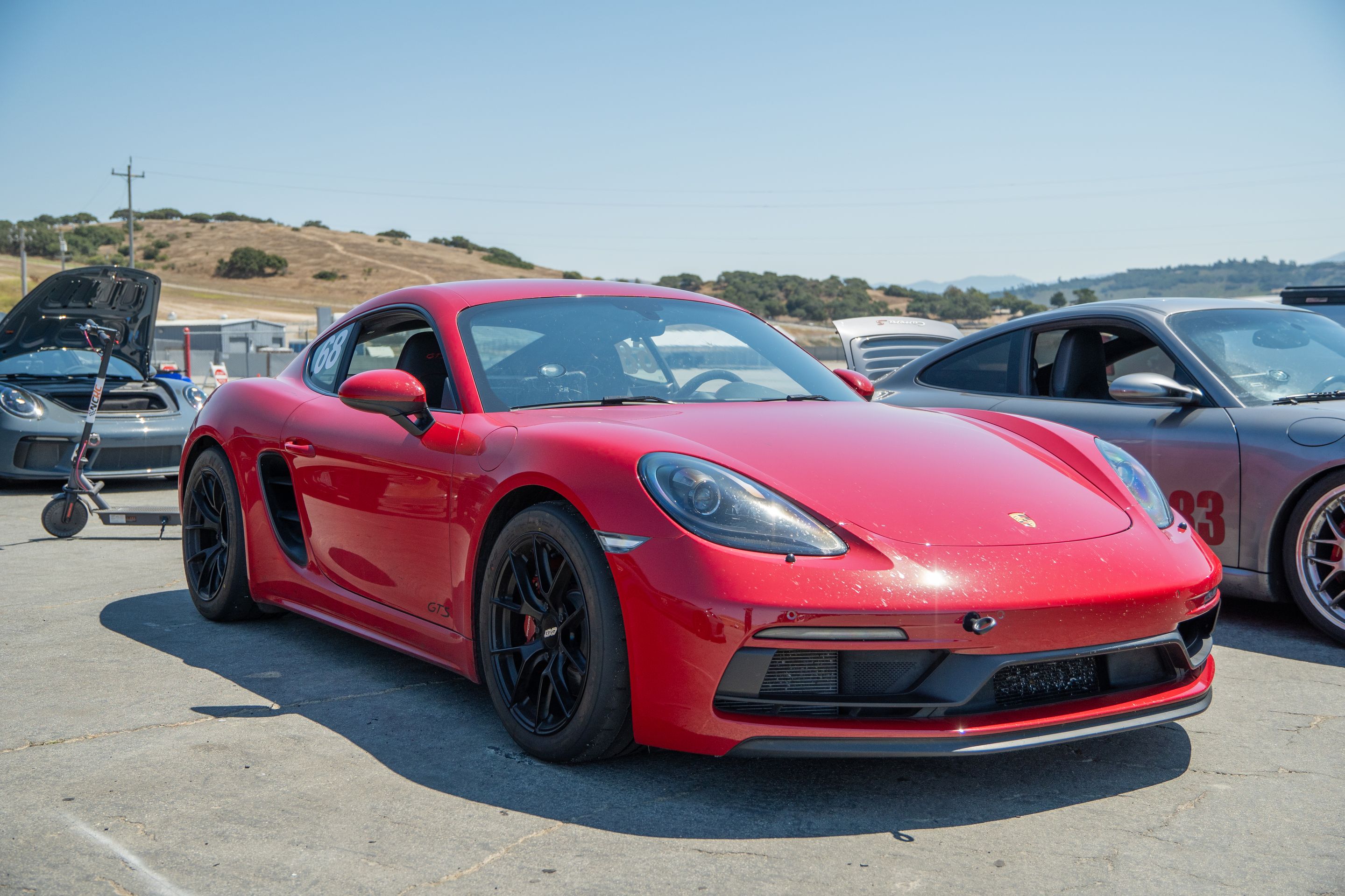 Red Porsche 718 Cayman GTS 2.5L with 18" VS-5RS Apex wheels in Satin Black